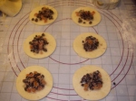 Pastry circles with a spoonful of fruit mixture