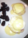 Eggs Benedict with a side of blackberries