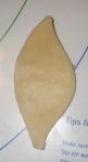 Apple-leaf shape cut from flaky pie dough