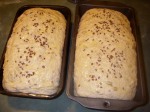 Egg-washed loaves sprinkled with sesame and flax seeds