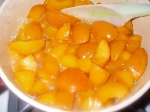 Apricots cooking. You don't have to cut them up, but I did a little.