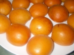 Apricot halves resting on a plate
